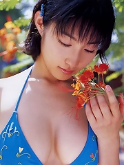 Incredible asian babe in a bikini shows off her big plump boobs