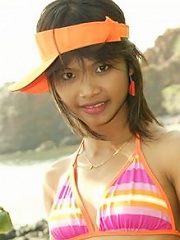 18 year old Thai teen in orange bikini at the beach